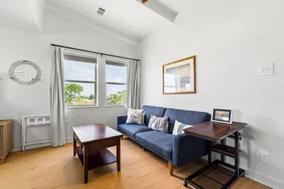 Discover a cozy private sitting area, complete with a comfy couch and center table, perfect for morning coffee or winding down with a good book.