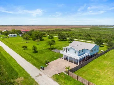 Right off the street, a spacious parkway provides convenient parking just steps from the front door, making arrivals and departures effortless for guests.