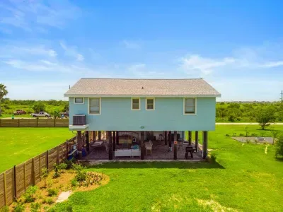 An overhead view of Captain’s Quarter, spacious yard and a growing orchard ready for future harvests.