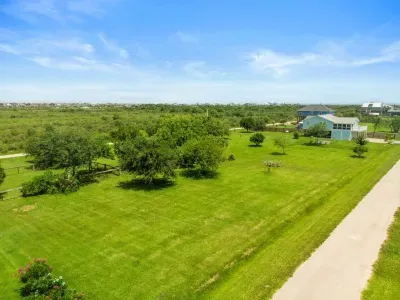 An overhead view of Captain’s Quarter, spacious yard and a growing orchard ready for future harvests.