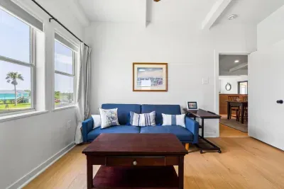 Discover a cozy private sitting area, complete with a comfy couch and center table, perfect for morning coffee or winding down with a good book.