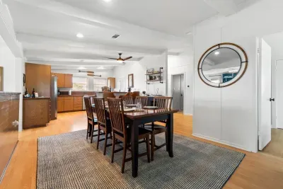 Gather around the cozy dining table for meals, games, or good conversation, seating for six right next to the heart of the home. ️