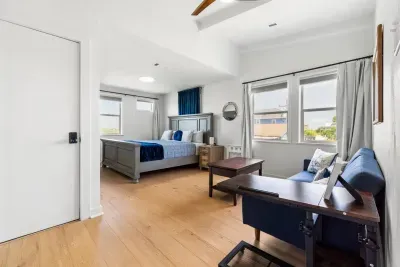 Step into the master bedroom and discover a cozy private sitting area, complete with a comfy couch and center table, perfect for morning coffee or winding down with a good book.