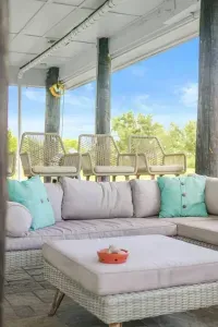 Unwind in comfort beneath the house, shaded, breezy, and perfect for relaxing after a day at the beach.