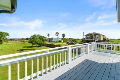 Take in the peaceful view from the balcony, the quiet road that leads to the beach, just a short stroll away.