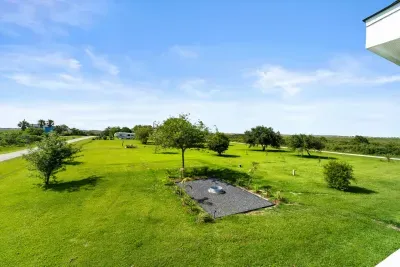 An overhead view of Captain’s Quarter, spacious yard and a growing orchard ready for future harvests.