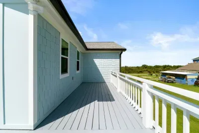 Take in the peaceful view from the balcony, the quiet road that leads to the beach, just a short stroll away.