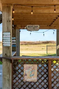 Kick back at the covered outdoor “beach bar” with string lights and coastal decor—an awesome spot to relax, mix a drink, and enjoy the fresh ocean air.