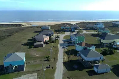 Coastal neighborhood views with the beach just minutes away, easy road access, and plenty of space to spread out—perfect for a relaxing getaway near the Gulf.