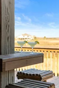 Sip margaritas on the deck and soak in the fresh coastal air with wide-open views.