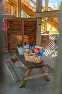 Kick back in our shaded hangout spot—cold drinks, snacks, string lights, and plenty of space to relax after a day at the beach!