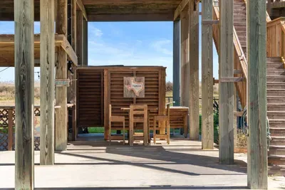 Spacious covered outdoor area with seating and plenty of room to spread out—perfect for hanging out, enjoying a drink, and relaxing in the coastal breeze.