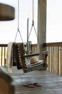 Unwind on the swing after a day at the beach—kick off your sandals, relax, and enjoy the coastal breeze.
