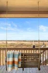 Start your morning on the porch swing with a warm cup of coffee and wide-open views of the dunes and Gulf in the distance.