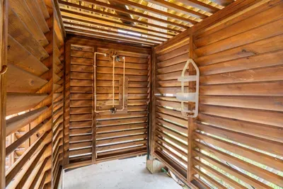 Rinse off after the beach in the private outdoor shower—perfect for sandy feet and salty hair before heading back inside.