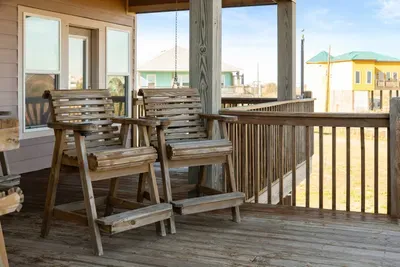 Relax on the spacious deck with plenty of seating and coastal views—perfect for morning coffee or sunset drinks.
