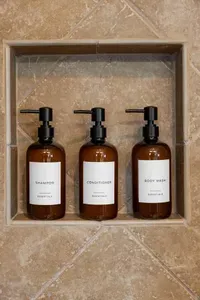 Enjoy hotel-style touches with shampoo, conditioner, and body wash provided in the walk-in shower—perfect for a fresh rinse after the beach.