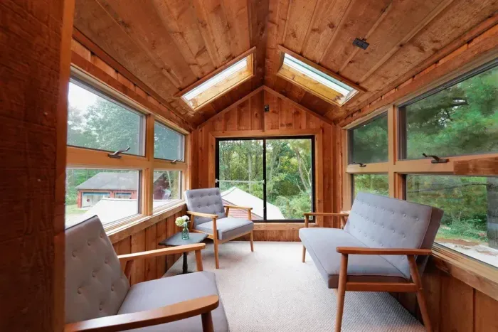The sunroom is the most delightful space to relax and enjoy a morning cup of coffee, read a book, and enjoy the natural surroundings.  This space is the perfect spot to take in the beautiful nature that surrounds Bear’s Lakeshore Lodge.