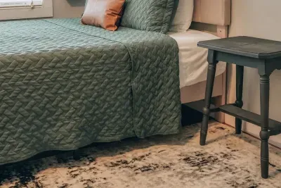 Turn in for the night in this comfy queen size bed. This bedroom is located on the lower level. You will find a dresser and an open wardrobe for hanging clothing. 