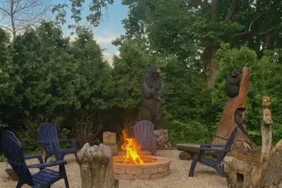 Cozy evening by the custom campfire, toasting marshmallows, chatting, and creating memories! The unique bear carvings will surely add some character to your stay at Bear's Lakeshore Lodge.