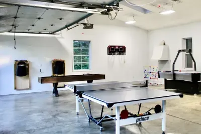 GAME ON! The heated gaming garage is sure to be a great time! It’s the perfect place to hang out for hours of fun! You will find a ping pong table, air hockey, shuffle board, and more! 
