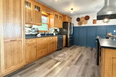 The kitchen cupboards and drawers are filled with all the necessities to cook meals right at the house! A large pantry is left open to make storing your groceries easy and accessible! 