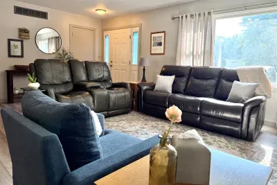 Get cozy! The main living room offers a couch, loveseat, chair, and smart TV. The perfect place to unwind after a fun filled day exploring Southwest MI. 