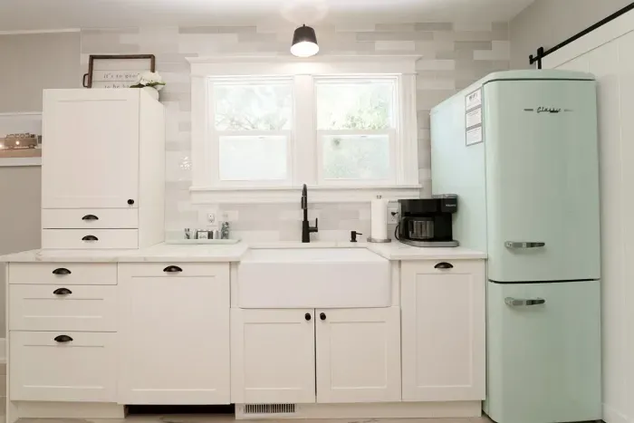 It’s the Classic Retro style appliances that really ties in the vintage charm. The kitchen is fully stocked, including a Keurig duo, crockpot, blender, and toaster.