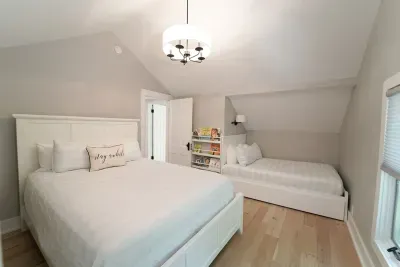 This upper level bedroom is complete with a cozy full bed and queen bed. You will find a cute play nook for kids and books for bedtime stories after a day of making memories! 