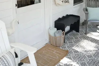 The adorable front porch welcomes you back home to Marlowe's Haven after a day of fun in South Haven. 