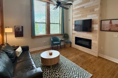 Settle in and watch a movie or your favorite show! The living room is a great spot for relaxing. Featuring a cozy pullout couch, a chair, a smart TV, and a no heat fireplace.