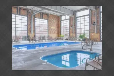 Rain or shine, enjoy the community pool & hot tub at Central Lofts. During the cooler months, enjoy the enclosed heated pool and hot tub area.