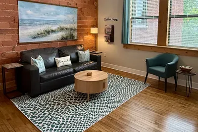 Settle in and watch a movie or your favorite show! The living room is a great spot for relaxing. Featuring a queen size pullout couch, a chair, a smart TV, and a no heat fireplace.