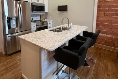 Be a part of the conversation by making use of the two bar stools at the kitchen counter. You will find everything necessary to make you feel right at home in the kitchen; including a Keurig, wine glasses, blender, toaster, and more.