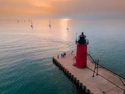 Strolling along South Haven's riverwalk to reach the iconic red lighthouse on the pier is a must-do activity for guests staying at Maddie's Haven.
