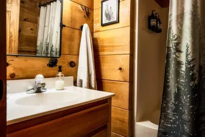 Loft bathroom with shower and tub.