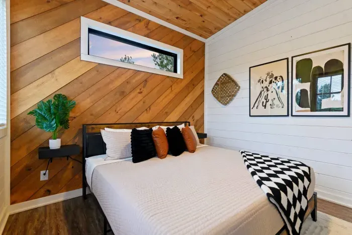 [Upstairs primary] Catch the beautiful sunrise through this window and our professional artwork from one of our favorite artists