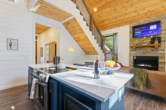 [Kitchen] Oven and stove, view of TV from kitchen, large open space