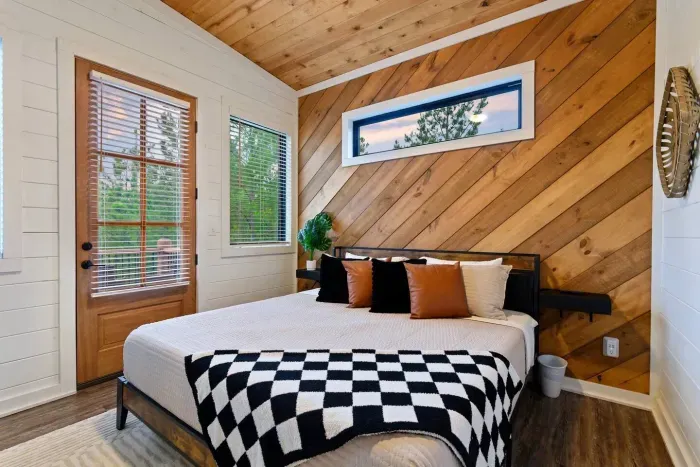 [Upstairs Primary] Imagine staying in this gorgeous room. King bed, professionally decorated, and hotel grade linens. Yes please! Access to private master balcony