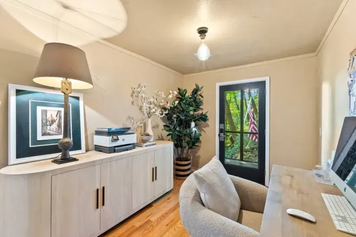 An entry with a view and workspace. You'll have access to a printer with a desk and comfy rolling chair.