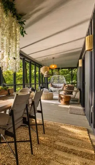 Enjoy al fresco dining on the spacious wraparound porch—complete with an outdoor grill and river views.