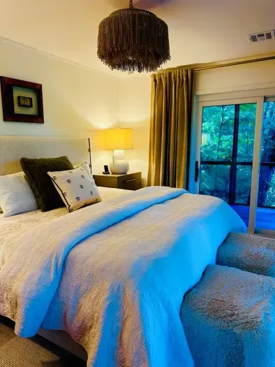 Send this to the group chat. Three bedrooms. Two baths. A wraparound riverfront deck. Beautiful interiors. Someone just needs to pick the dates.