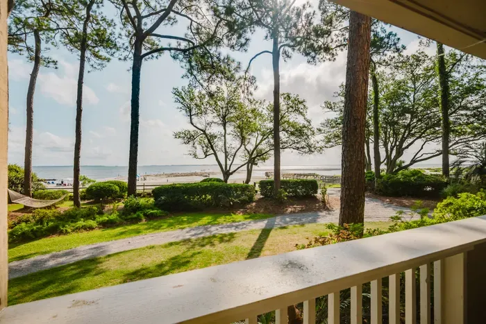 Peaceful balcony view with lush grounds and easy beach access