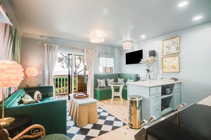 Bright chic studio with patio access, kitchenette, and cozy lounge seating