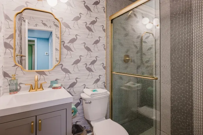 Chic bathroom with gold accents and a glass walk-in shower