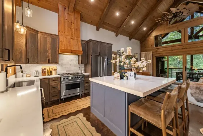 Gather around the heart of the home—a chef’s kitchen with soaring ceilings, custom finishes, and a spacious island perfect for shared meals and conversation.