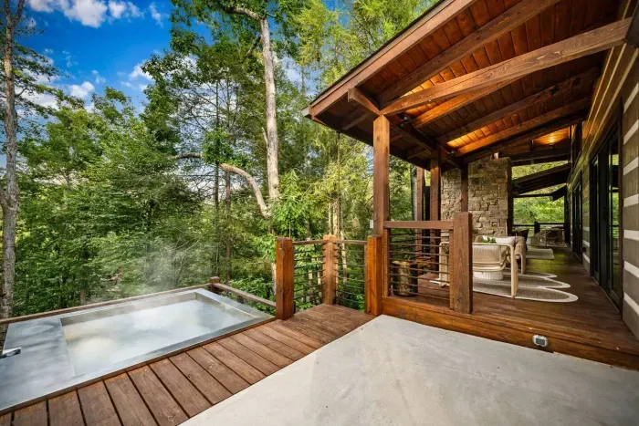 Soak in serenity. Our custom stainless steel hot tub sits creekside, offering the ultimate relaxation with forest views and the sound of rushing water below.