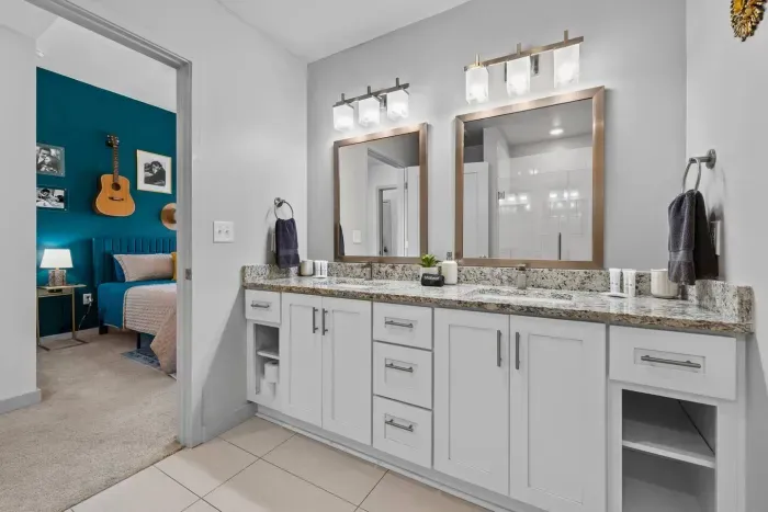 Bathroom to the June bedroom, complete with double sinks and a tile shower.