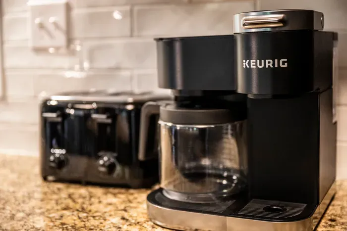 Keurig with a carafe option, so the one person who drinks four cups and the one who drinks one both get what they need. Toaster's right there.