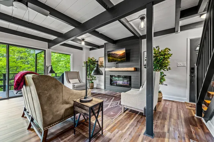 Open floor plan front to back — living, wet bar, and stairs all flow together, so nobody's stuck in a separate room.